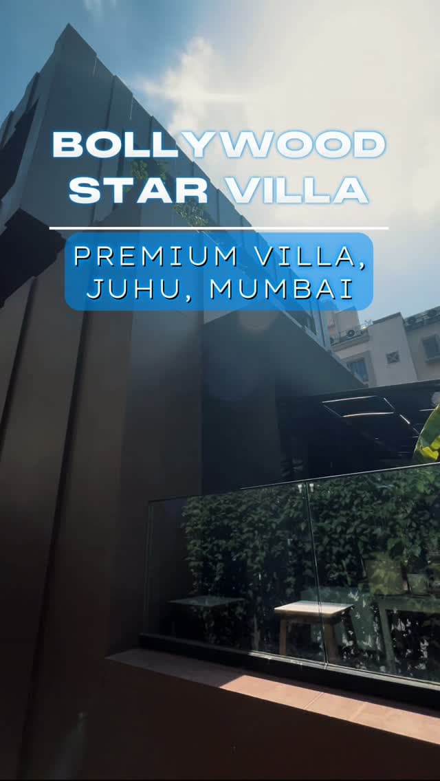 Dark-clad premium villa in Juhu with a glass balustrade terrace, captioned Premium villa, Juhu, Mumbai.